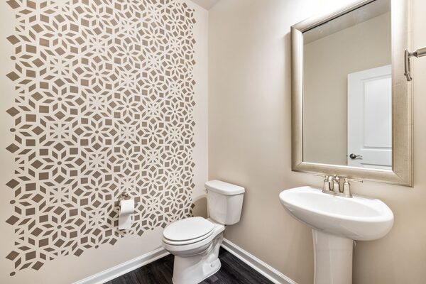 Contemporary room with a neutral geometric patterned feature wall